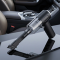 Cordless car vacuum cleaner with wireless charging — studio product photo